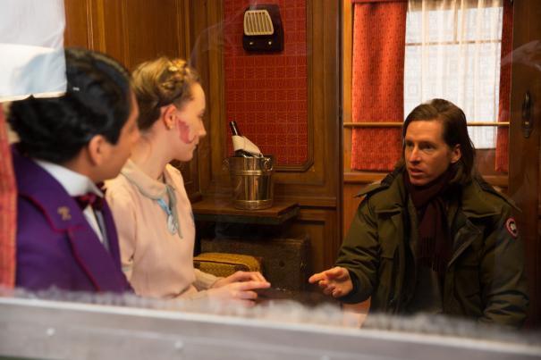 Tony Revolori, Saoirse Ronan and Wes Anderson on the set of THE GRAND BUDAPEST HOTEL.