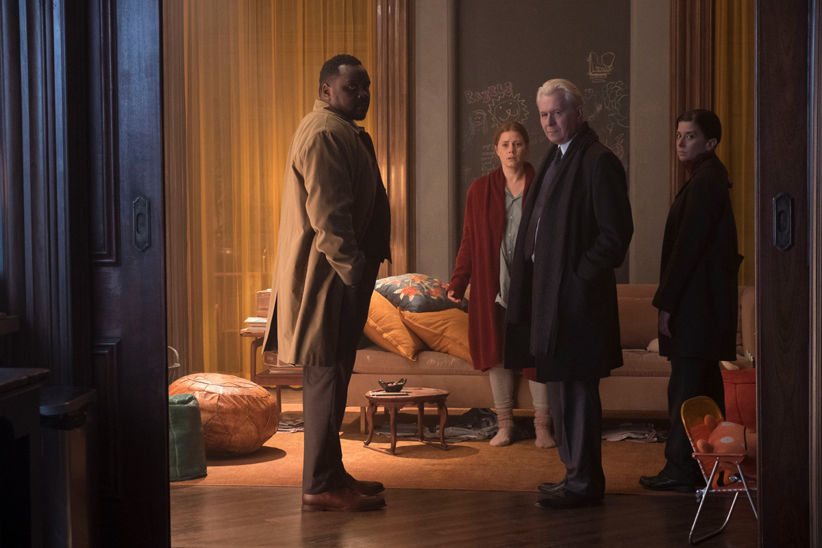 Woman in the Window (2021), L to R: Brian Tyree Henry as Detective Little, Amy Adams as Anna Fox, Gary Oldman as Alistair Russell, and Jeanine Serralles as Detective Norelli